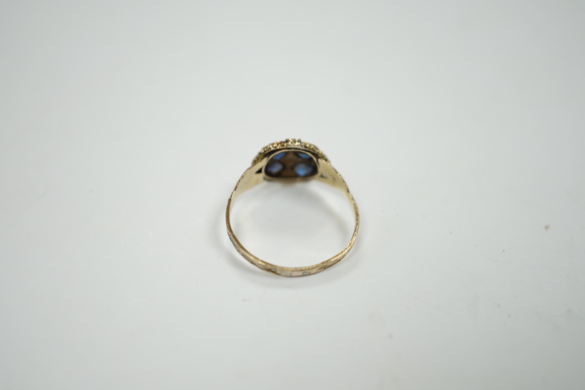 A Victorian 12ct gold sapphire and seed pearl cluster set ring, size M, gross weight 1.6 grams.